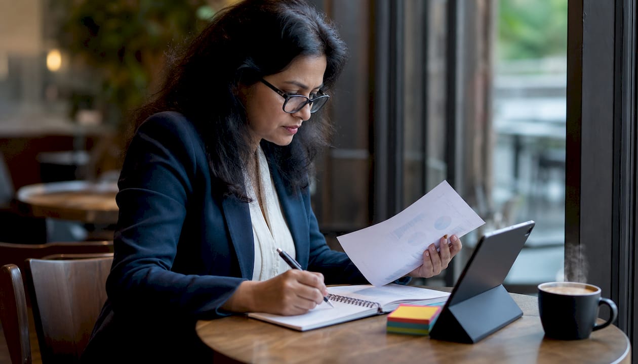 IT manager reviewing AI optimization strategy documents
