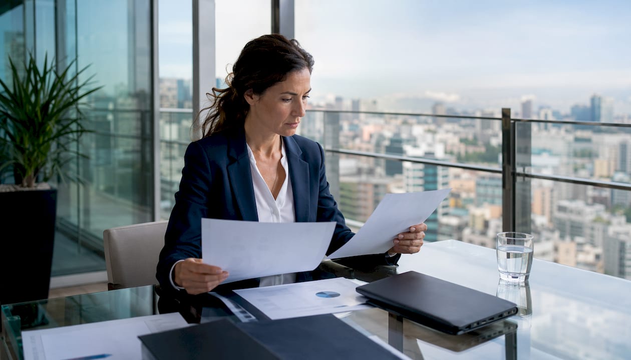 IT security manager reviewing AI governance framework documents