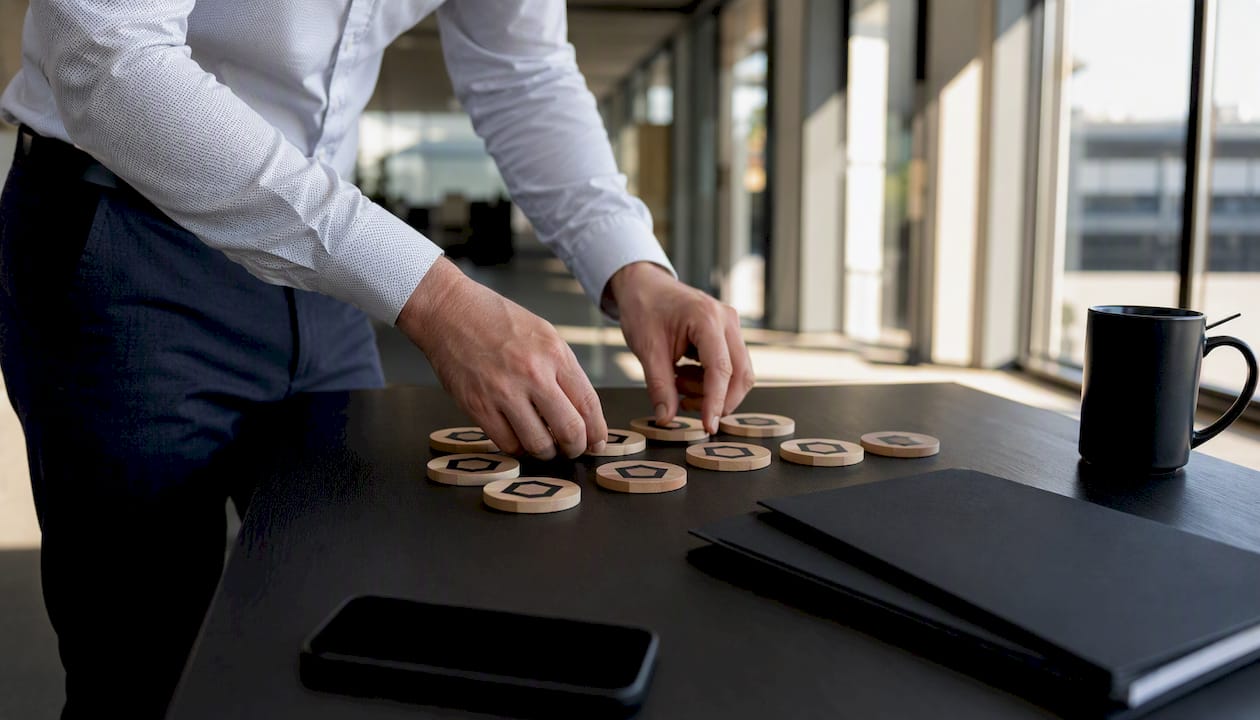 Hands managing SaaS license tokens on desk