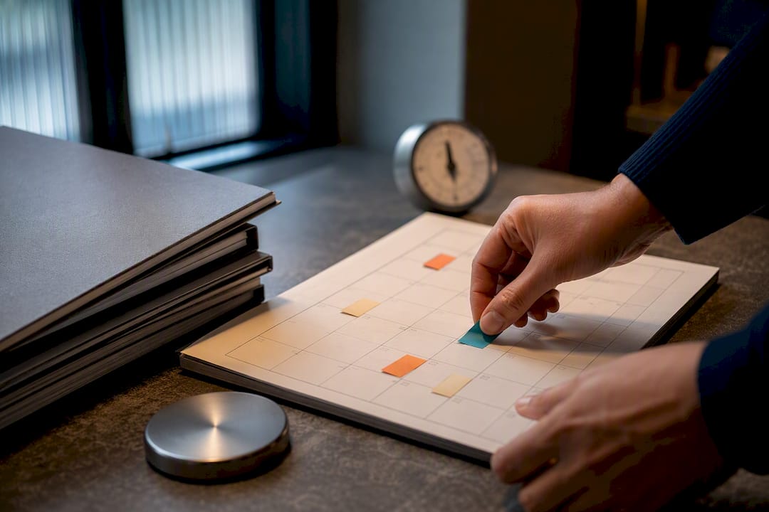 Hands organizing SaaS renewal deadlines