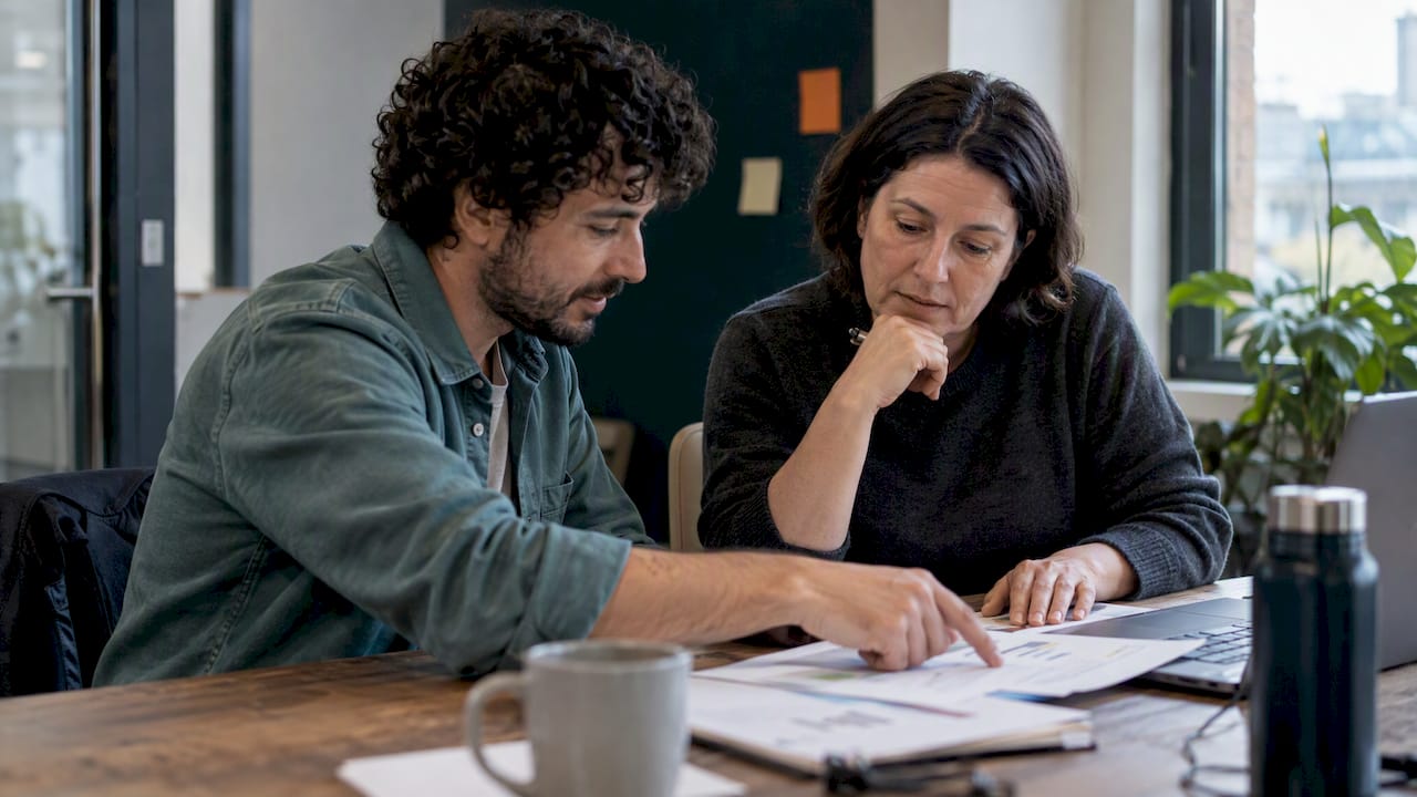 Finance and engineering colleagues review a cloud forecast